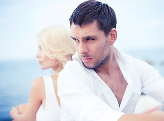 Image showing stressed man with woman outside