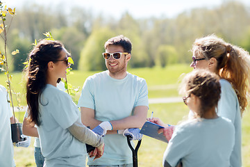 Image showing group of volunteers planting trees in park