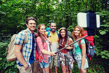 Image showing friends with backpack taking selfie by smartphone