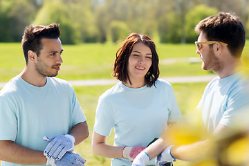 Image showing group of volunteers planting tree in park