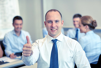 Image showing group of smiling businesspeople meeting in office