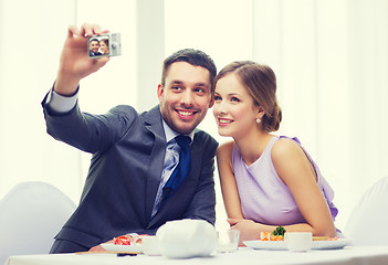 Image showing smiling couple taking self portrait picture