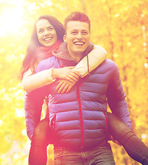 Image showing smiling friends having fun in autumn park