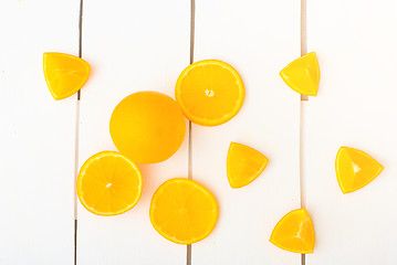 Image showing Colorful citrus fruits on the rustic white background.