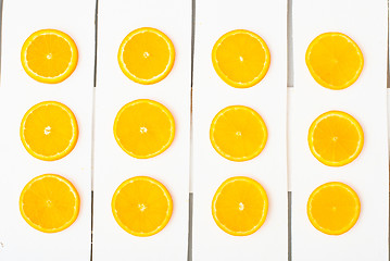 Image showing Colorful citrus fruits on the rustic white background.