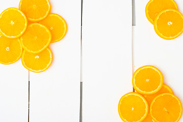 Image showing Colorful citrus fruits on the rustic white background.