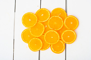 Image showing Colorful citrus fruits on the rustic white background.