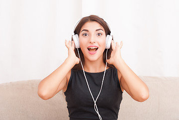 Image showing Woman listening music in headphones