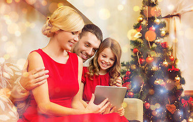 Image showing smiling family with tablet pc