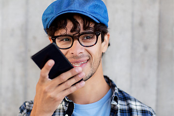 Image showing man using voice command or calling on smartphone