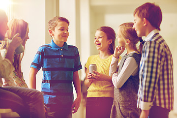 Image showing group of school kids with soda cans in corridor