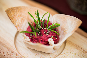 Image showing close up of dough cornet with beetroot filling