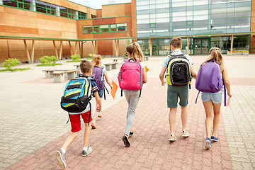 Image showing group of happy elementary school students running