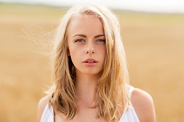 Image showing young woman in white on cereal field