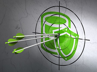 Image showing Programming concept: arrows in Database With Shield target on wall background