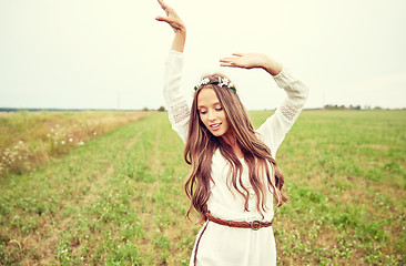 Image showing smiling young hippie woman on cereal field