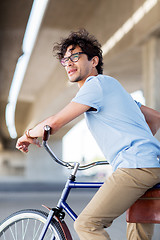 Image showing young hipster man riding fixed gear bike