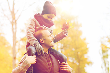 Image showing happy family having fun in autumn park