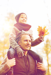 Image showing happy family having fun in autumn park