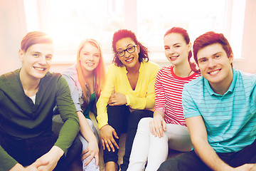 Image showing five smiling teenagers having fun at home