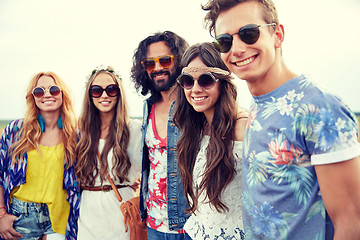 Image showing smiling young hippie friends outdoors