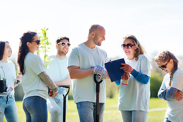 Image showing group of volunteers planting trees in park