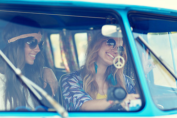 Image showing smiling young hippie women driving minivan car