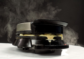 Image showing Making of fresh steaming hot waffles