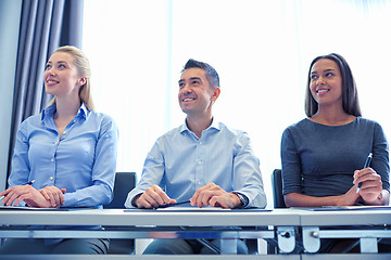 Image showing smiling business people meeting in office