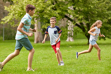 Image showing happy kids running and playing game outdoors