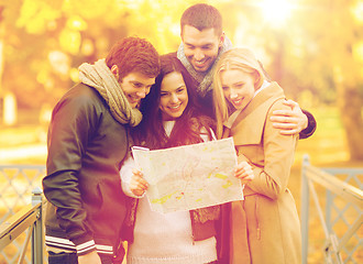 Image showing couples with tourist map in autumn park