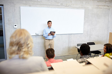 Image showing students and teacher with tablet pc at lecture