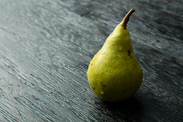 Image showing Green pear on a dark background