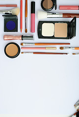 Image showing makeup brush and cosmetics, on a white background