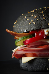 Image showing Gourmet black burger with Spicy sauce