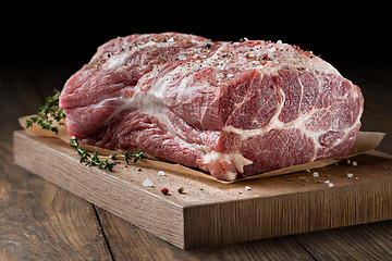 Image showing Photo of raw meat. Pork neck with herbs