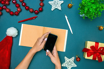 Image showing The famale hands with Christmas decorations.