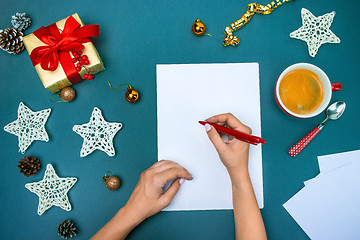 Image showing The famale hands with Christmas decorations.