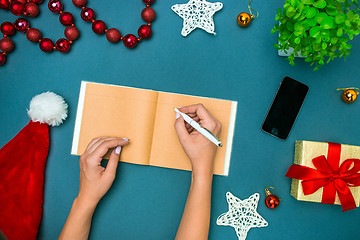 Image showing The famale hands with Christmas decorations.