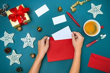 Image showing The famale hands with Christmas decorations.