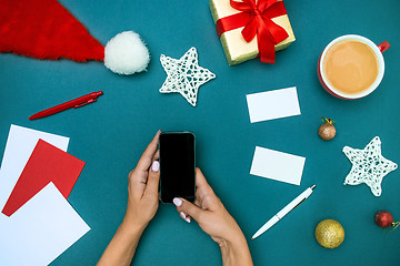 Image showing The famale hands with Christmas decorations.