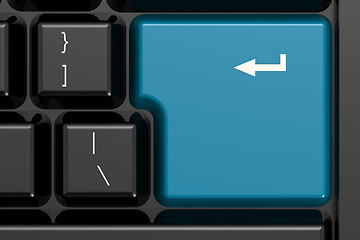 Image showing Blue enter key on black keyboard