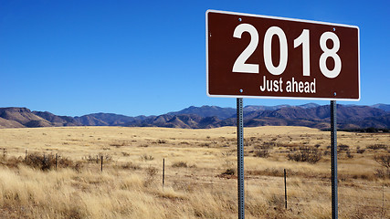 Image showing 2018 Just Ahead brown road sign