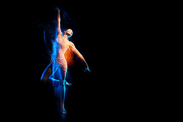 Image showing Fine art portrait of beautiful woman dancer in blue sparkles