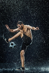 Image showing Water drops around football player under water