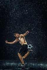 Image showing Water drops around football player under water