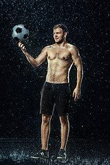 Image showing Water drops around football player under water