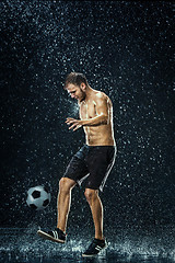 Image showing Water drops around football player under water