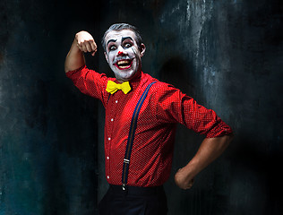 Image showing Terrible clown and Halloween theme: Crazy red clown in a shirt with suspenders