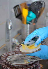 Image showing Woman hand washing dishes